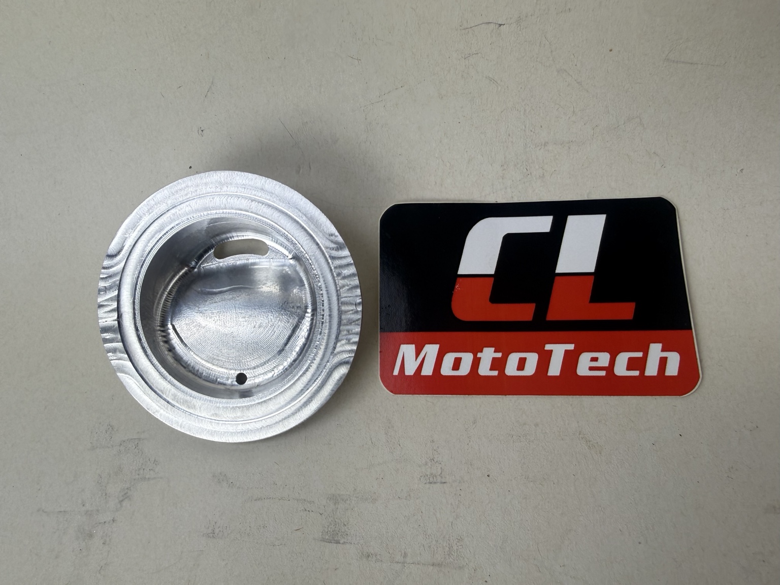 Underside of the JarMagic lid showing the machined interior and sealing rim