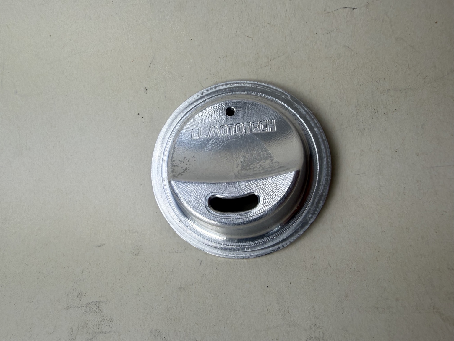 JarMagic billet aluminum lid showing the drinking opening, vent, and machined CL MotoTech name