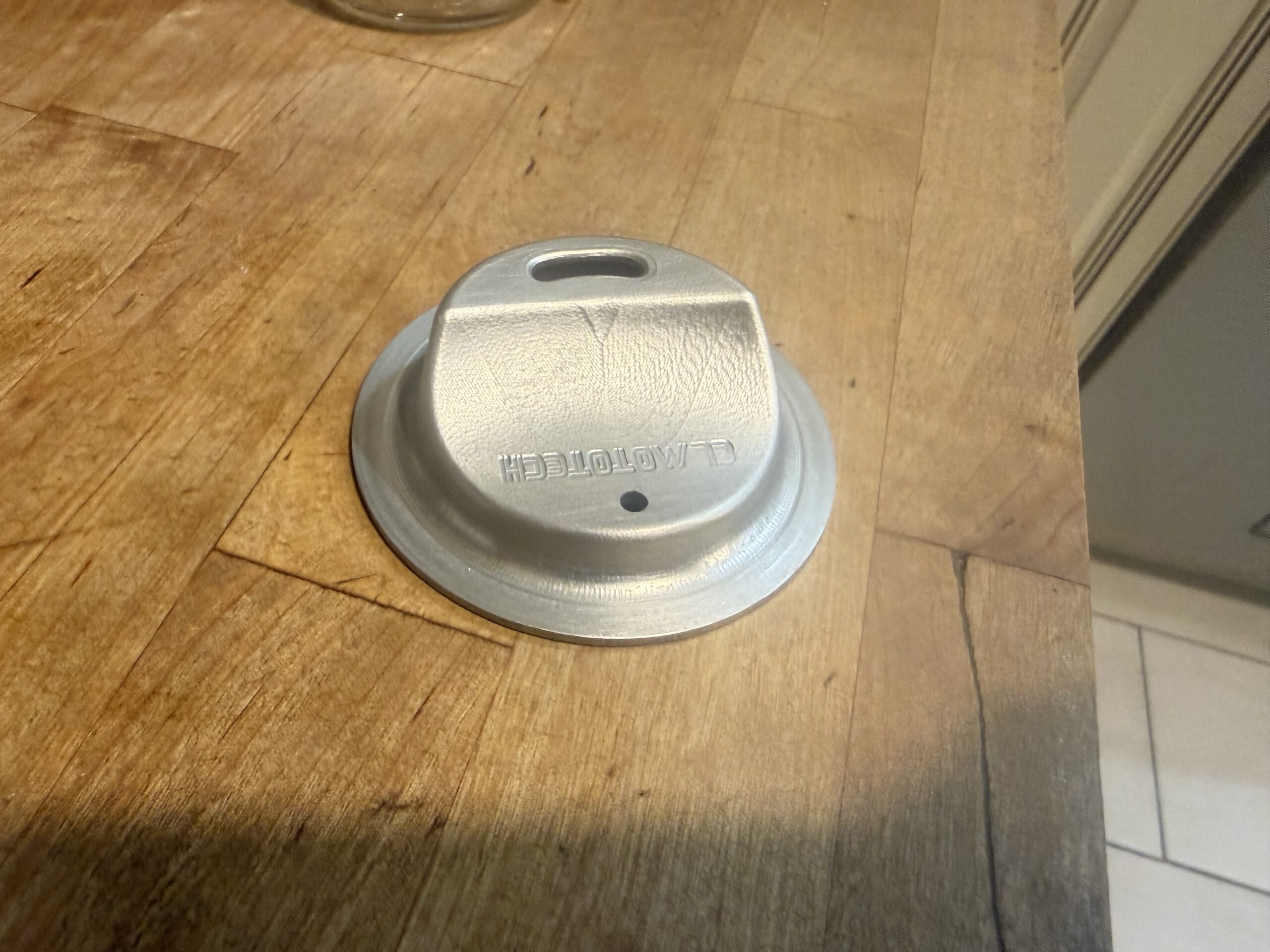 Silver anodized JarMagic aluminum lid with machined CL MotoTech lettering