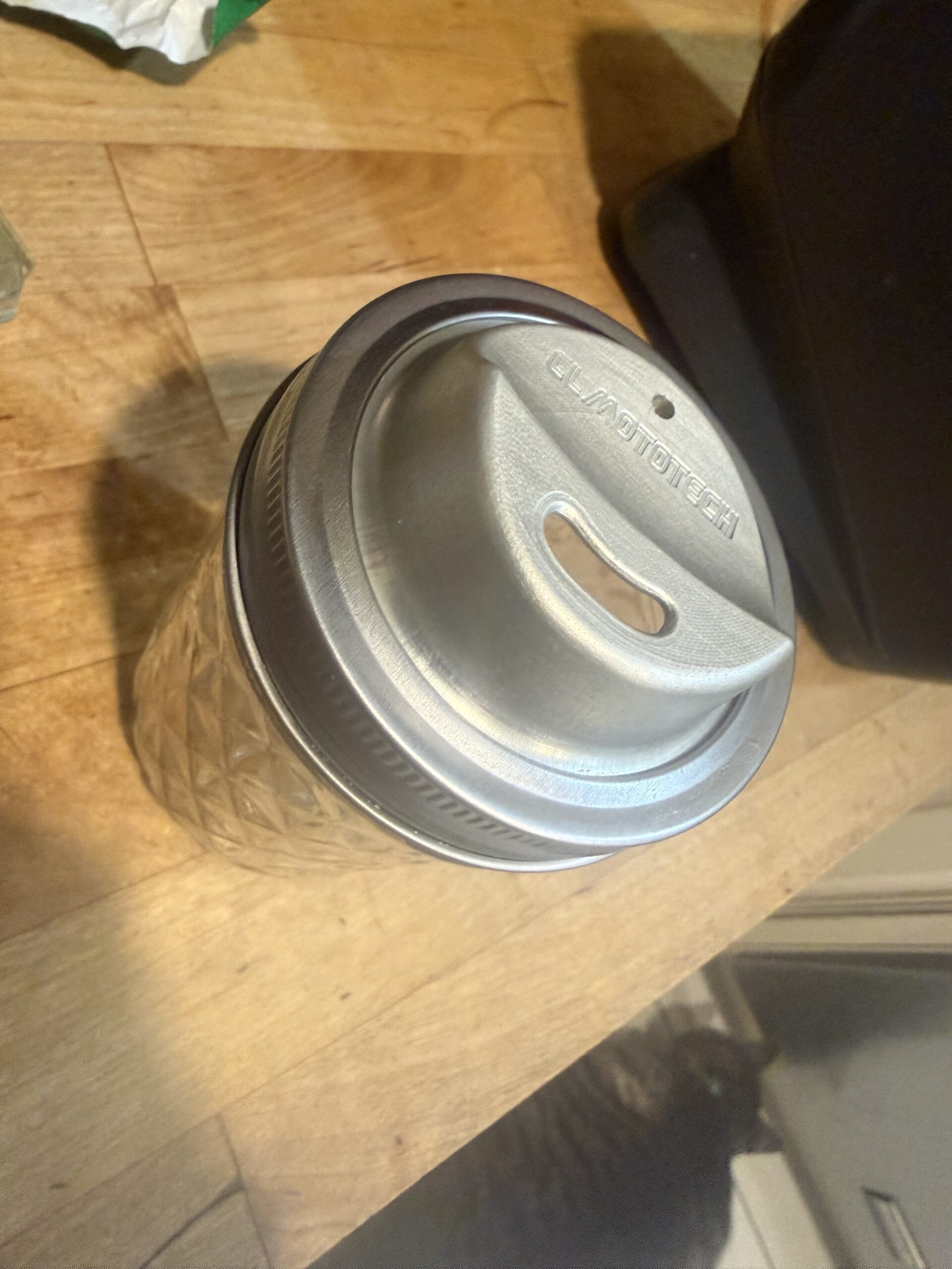 Anodized JarMagic aluminum lid fitted to a Ball mason jar with a stainless steel band